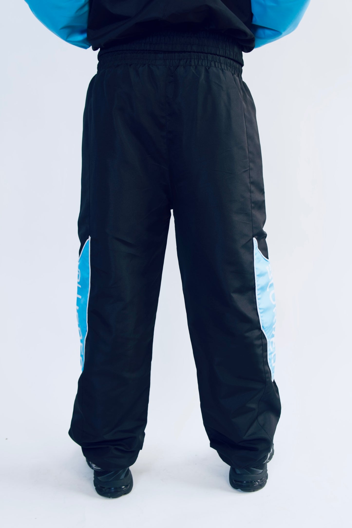 LIGHT BLUE/BLACK WINDBREAKER PANTS